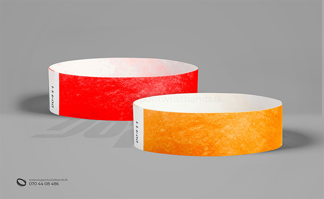 Red and orange solid colour paper hand bands / wristbands